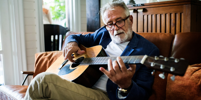 10 benefits of learning to play a musical instrument old man guitar